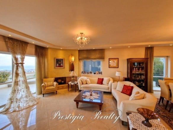 Luxurious living room with a fireplace in a villa in Panorama Voula, Athenian Riviera