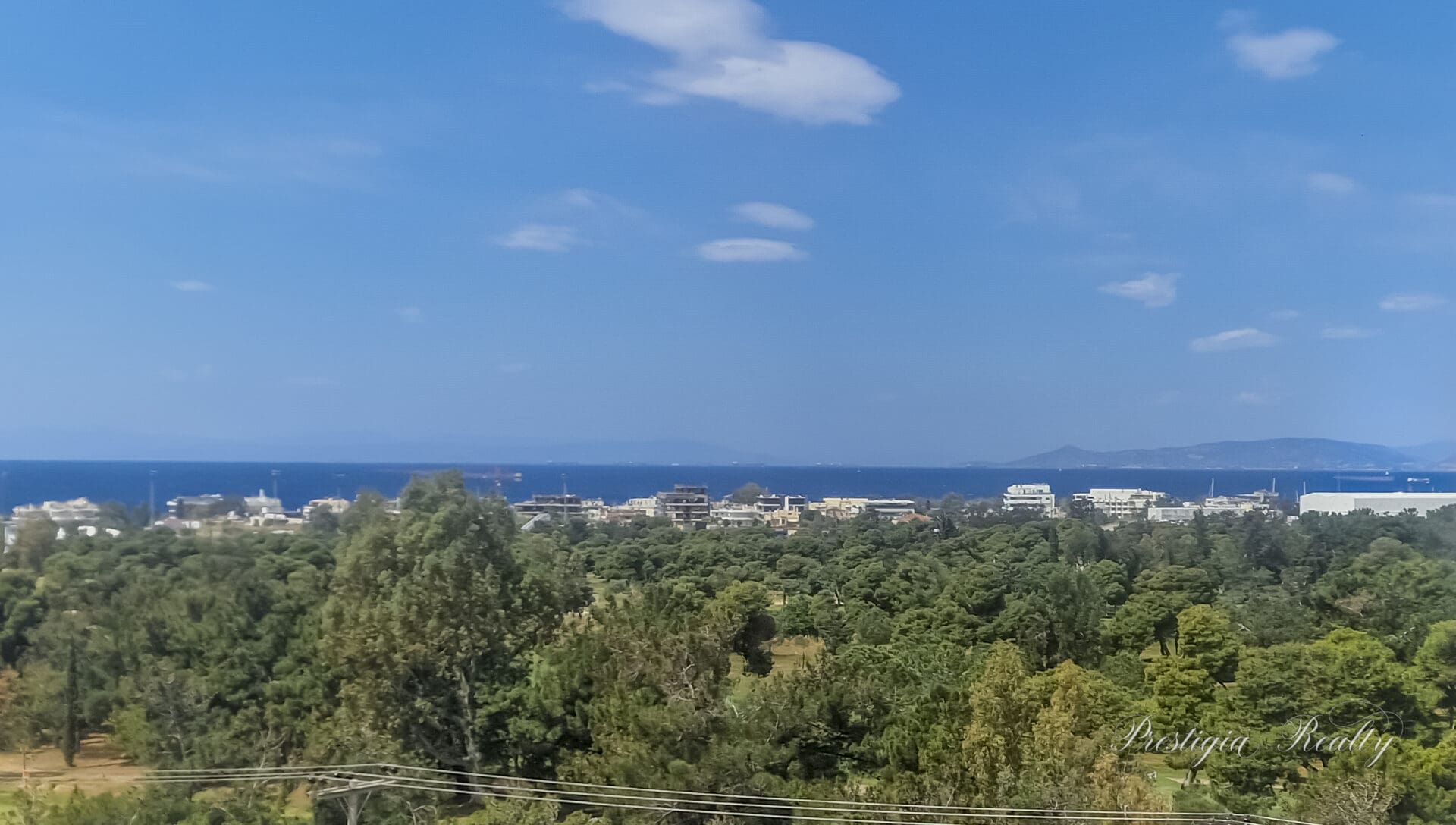 Luxury penthouse maisonette in Glyfada Golf featuring rooftop pool, panoramic sea and skyline views, and modern architecture in an elite Athenian neighborhood